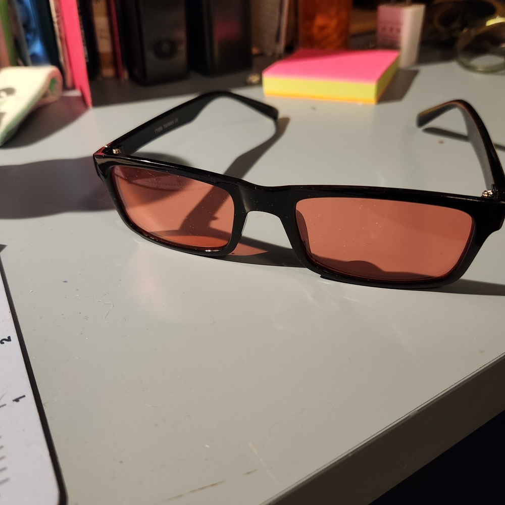 Stylish Black Sunglasses with Red Lenses